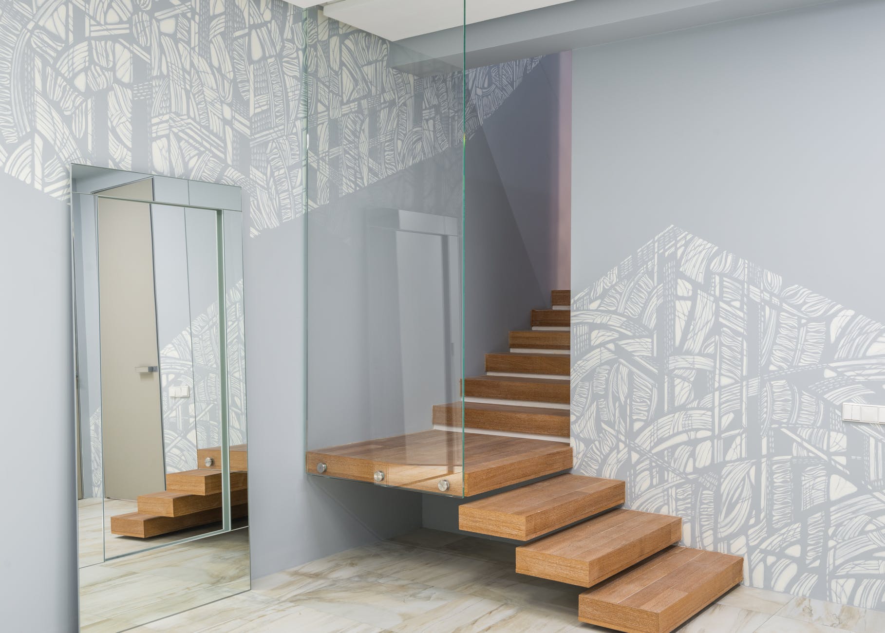 staircase with glass wall in modern apartment